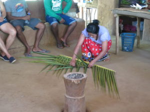 The roof is made of palm leaves. Village visit at Sigiriya