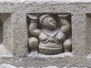 Another figure on hard work in the temple of the Tooth